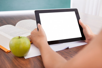 Student holding digital tablet