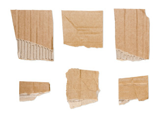 collection of ripped  brown pieces of cardboard isolated on whit