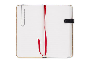 blank page of note book with paper clip and elastic strap isolat