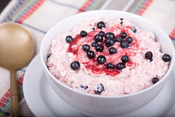 Cottage cheese with strawberry jam and blueberries