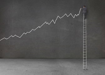 Businessman standing on a giant ladder © WavebreakMediaMicro