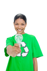 Smiling model wearing recycling tshirt holding light bulb