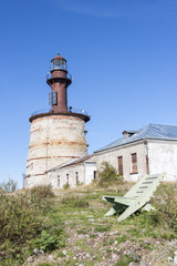 Chair in front of a lighthouse © RistoH