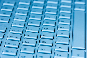 Computer keyboard in blue light