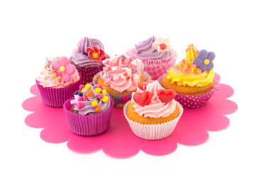 Colorful cupcakes on tray