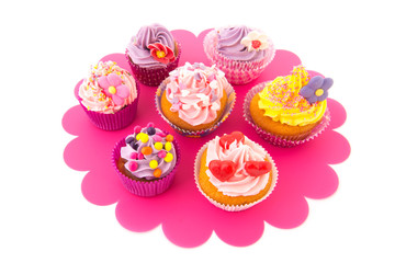 Colorful cupcakes on tray