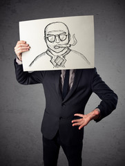 Businessman holding a cardboard with a smoking man on it in fron