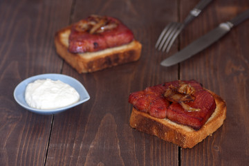 baked smoked pork neck with onion, toasts and horseradish dip