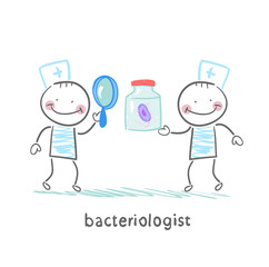 Naklejka premium bacteriologist looking through a magnifying glass on the bacteri