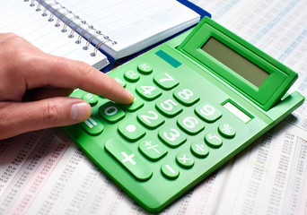 Hand of a businessman with calculator.