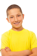 Happy smiling boy in yellow shirt