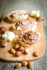 Slices of bread with chocolate cream and nuts
