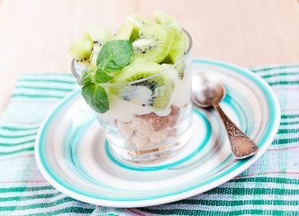 Kiwi Eton mess - dessert with meringue, whipped cream and fruits