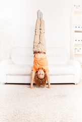 Boy standing on hands