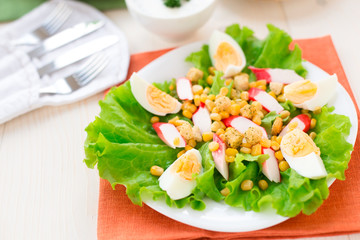 Salad with eggs, crab sticks and corn