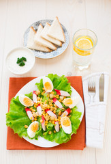 Salad with eggs, crab sticks and corn