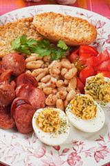 Deviled eggs with beans and sausage