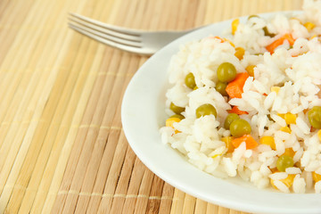Risotto on plate on light background