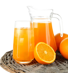 Glass and pitcher of orange juice isolated on white