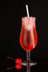 Cherry cocktail with ice isolated on black