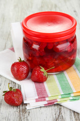 Home made berry jam on wooden table