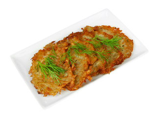 Potato pancakes on plate, isolated on white