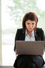 Business school student with laptop