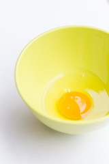 raw eggs on a green cup