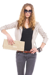 woman in sunglasses with curly blond hair holding purse posing