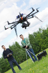 Engineers Flying UAV Drone in Park
