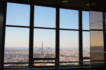 Paris behind window.
