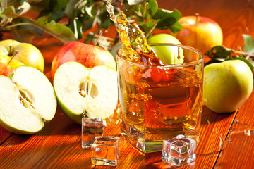 A glass of apple juice with fresh fruits