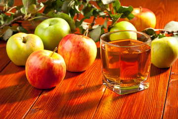 A glass of apple juice with fresh fruits