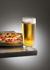 Pizza with a glass of beer