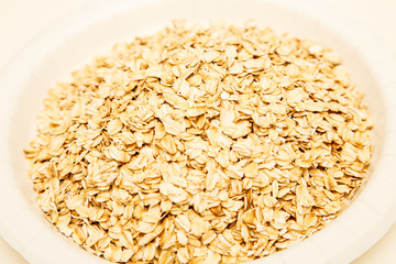 Dried Oats in a White Bowl