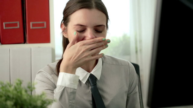 Sick businesswoman working in the office