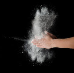 Fototapeta na wymiar Freeze motion of dust explosion in hands