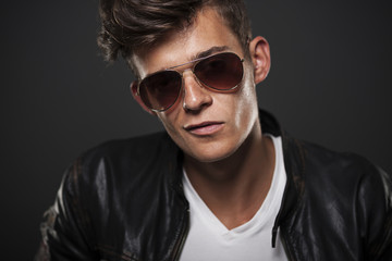 Obraz premium Portrait of bad boy wearing glasses