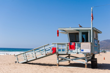 Life Guard Tower under the blue sky in Malibu Beach - obrazy, fototapety, plakaty