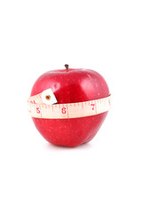 Fresh apple with measuring tape