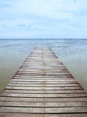 Fototapeta premium Wooden jetty during low tide
