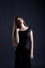 Fototapeta premium Sensual model posing in elegant cocktail dress