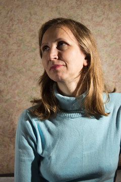 A woman in a blue sweater
