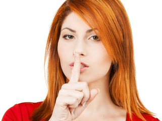 Naklejka premium woman with finger on her lips