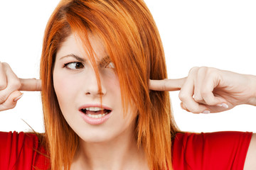 woman with fingers in ears