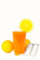 Orange juice and slices of orange on white