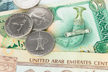 United Arub Emirates banknote and coins close-up
