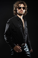Obraz premium Cool rock style dancing musician with long brown hair and beard.