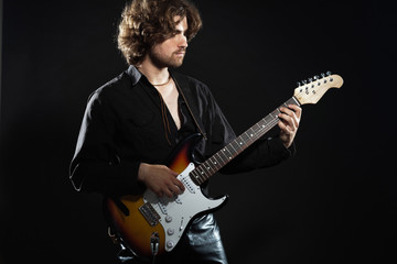 Obraz premium Psychedelic rock guitarist with long brown hair and beard. Dress