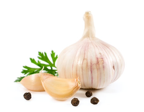 head of garlic with a piece of parsley